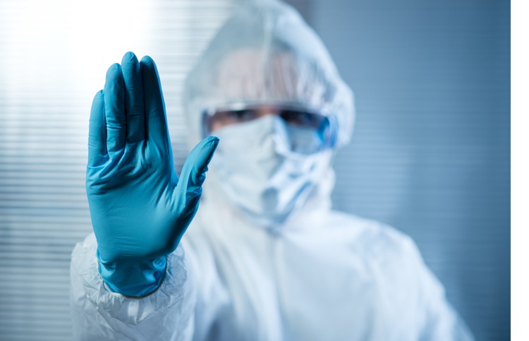 Scientist hold hand up in conern 