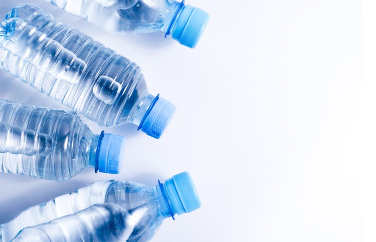 Several drinking water bottles on white background