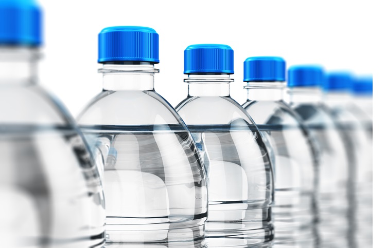 Row of plastic drink water bottles