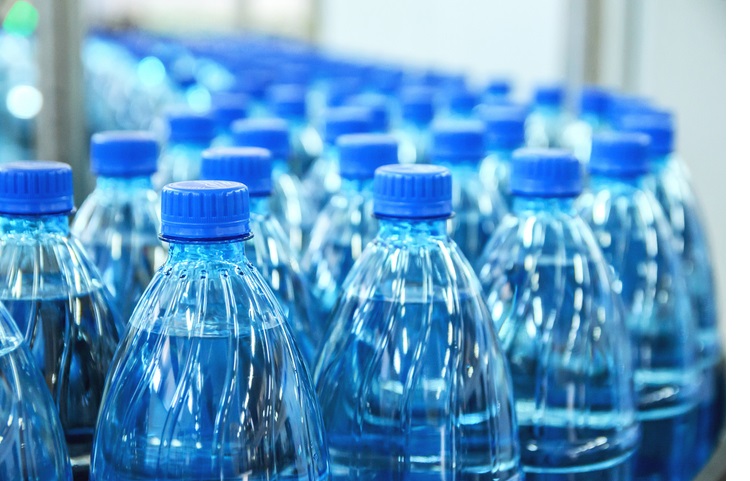 Closeup on mineral water bottles in raw and lines