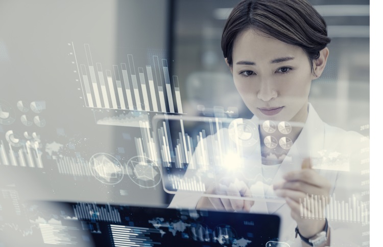 Female scientist looking futuristic GUI