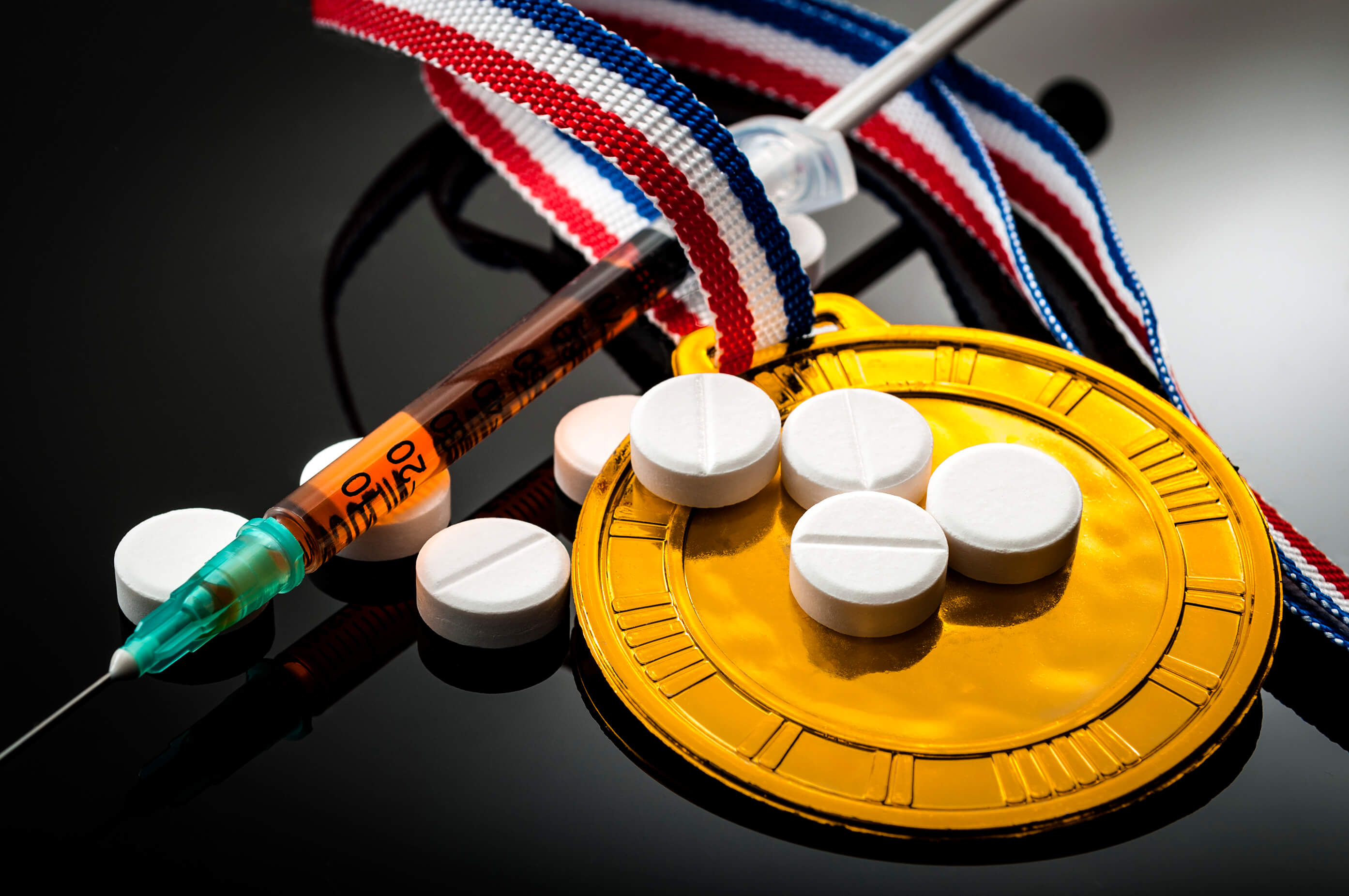 Athletes medal, pills and dope injection 