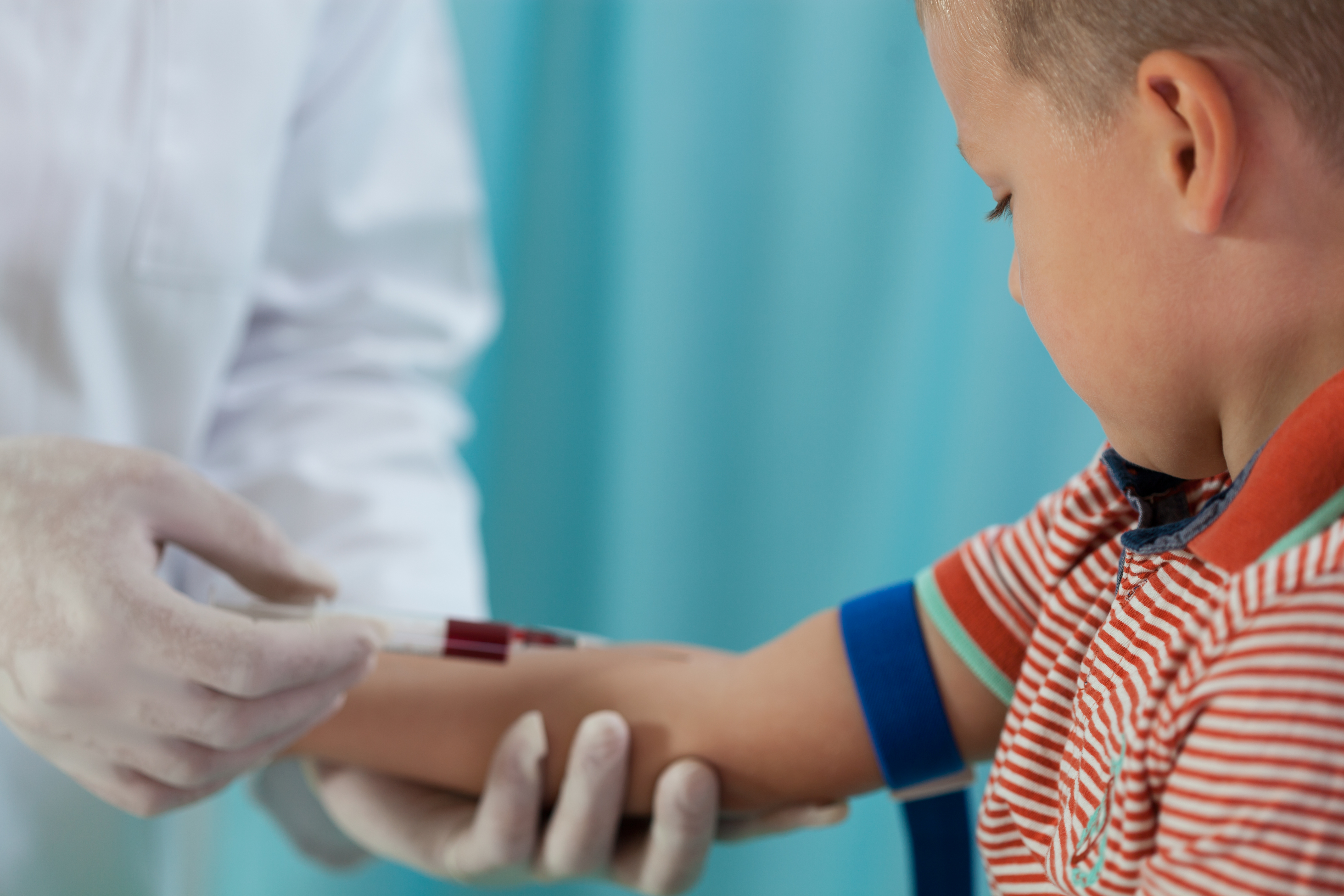 Boy taking blood 